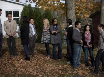 a group of students gathered in an outside setting.