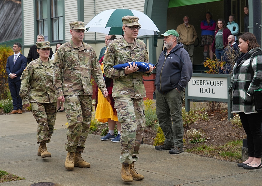 The Vermont National Guard raise the flag at VLGS's Veterans Day program.