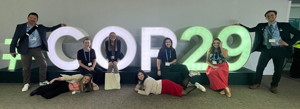 Group of VLGS students with the COP29 sign