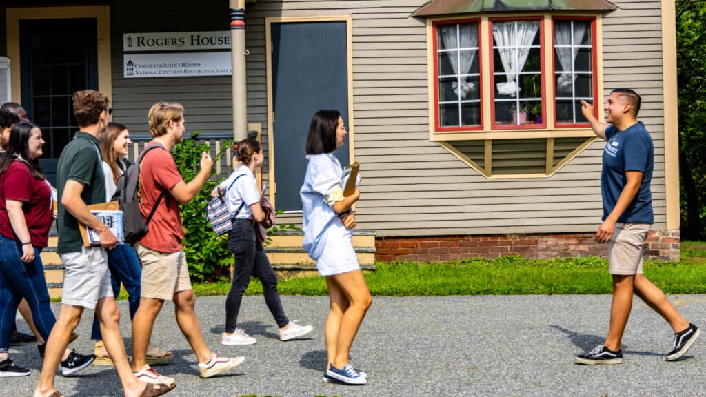 Isaiah Gonzales JD'25 leads a tour of prospective students, passing the Center for Justice Reform. 