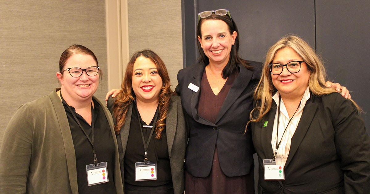 Dean Beth McCormack with three students from the Online Hybrid JD Program